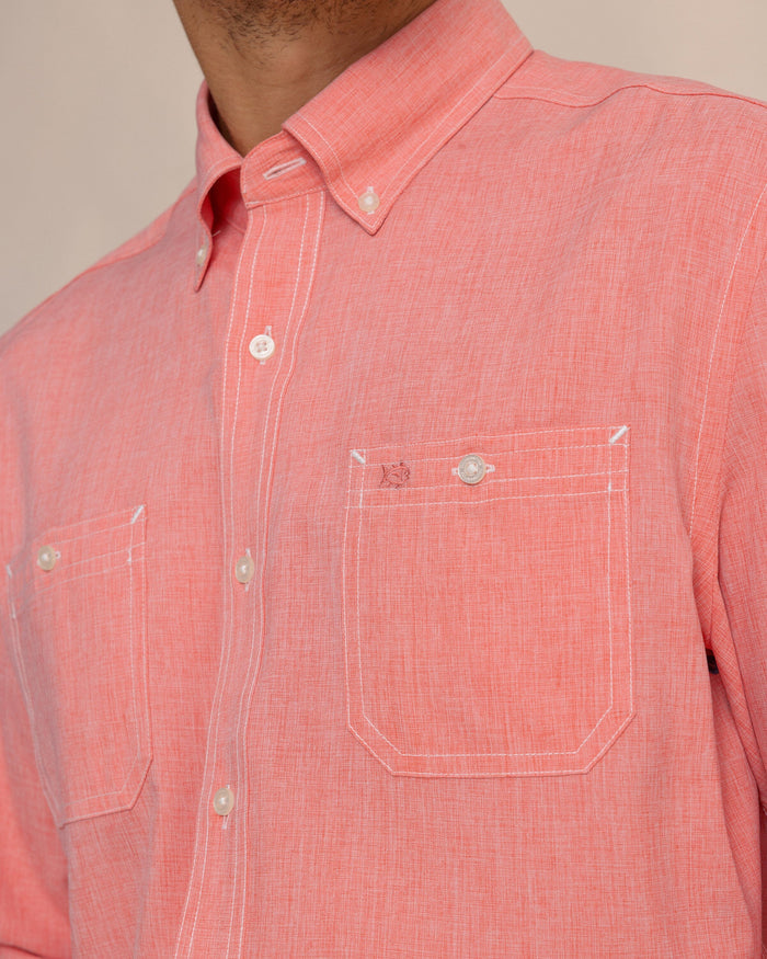 The detail view of the Southern Tide Dock Shirt by Southern Tide - Sunkist Coral