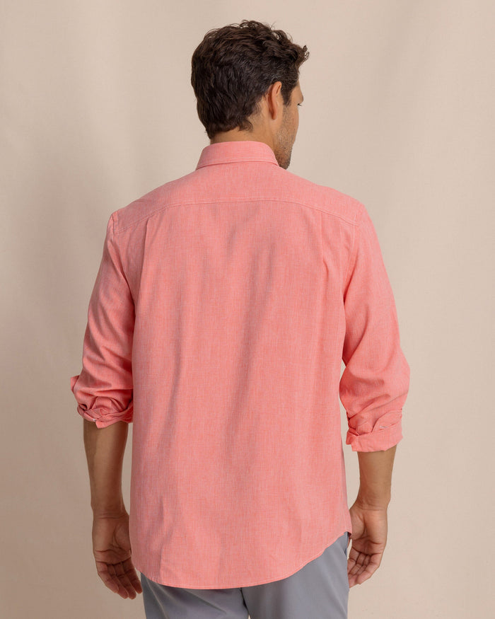 The back view of the Southern Tide Dock Shirt by Southern Tide - Sunkist Coral