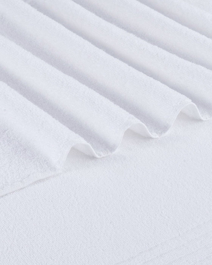 The detail view of the Southern Tide Performance Oversized Bath Towel by Southern Tide - Optical White