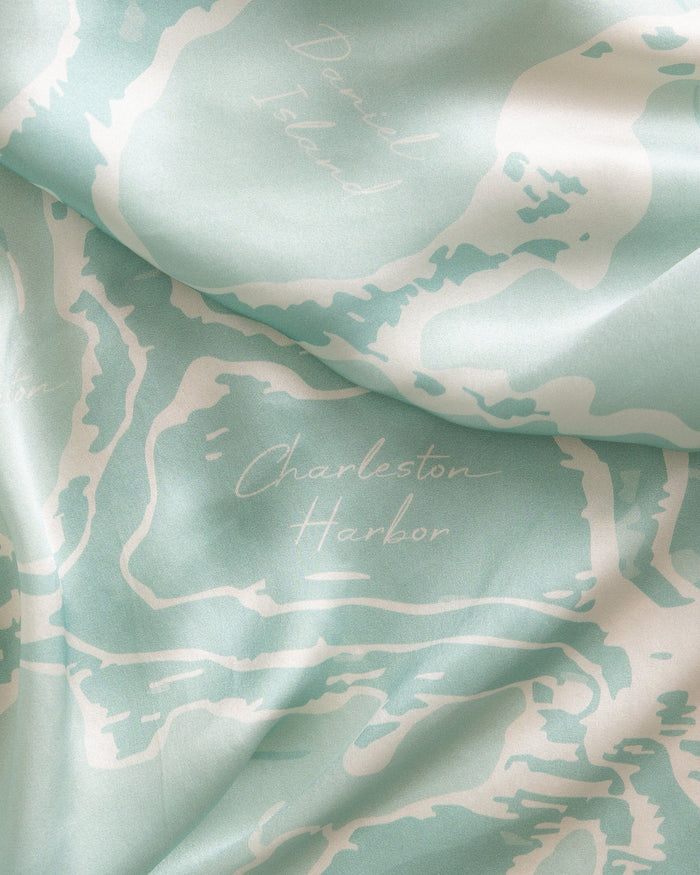 The detail view of the Southern Tide Swells Aerial Map Scarf by Southern Tide - Teal