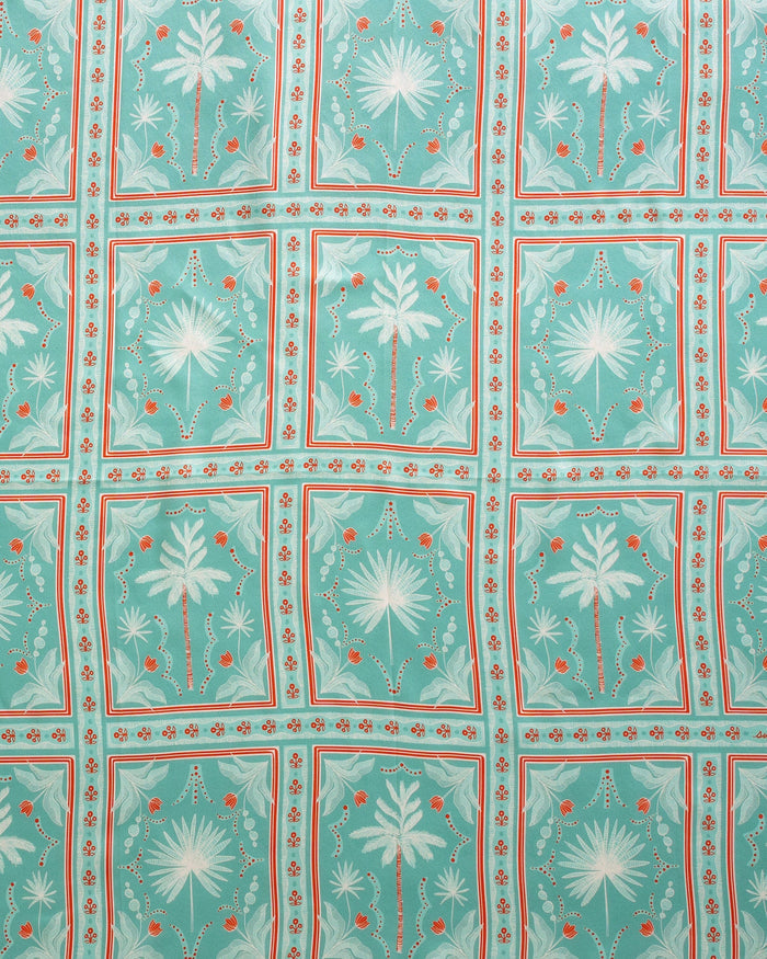 The detail view of the Southern Tide Swells Illustrated Palms Scarf by Southern Tide - Teal