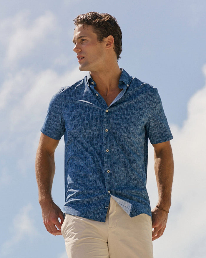 The lifestyle view of the Southern Tide ST Nautical Flags Coastal Breeze® Short Sleeve Sport Shirt by Southern Tide - Nautical Blue