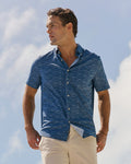 The lifestyle view of the Southern Tide ST Nautical Flags Coastal Breeze® Short Sleeve Sport Shirt by Southern Tide - Nautical Blue