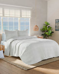 The side view of the Southern Tide Tideline Coverlet Quilt by Southern Tide - White Sand