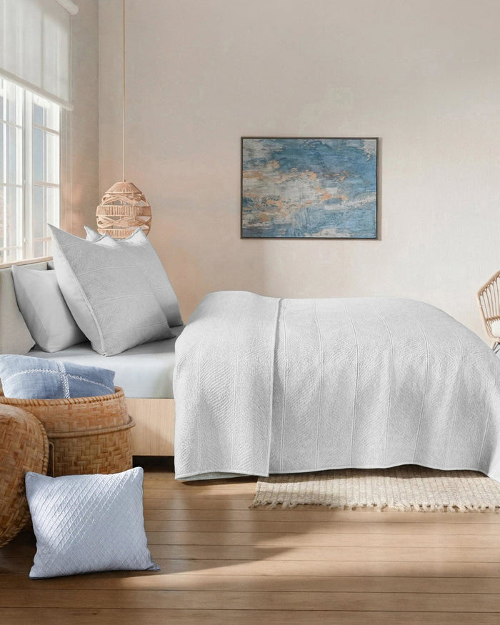 The side view of the Southern Tide Tideline Coverlet Quilt by Southern Tide - White Sand