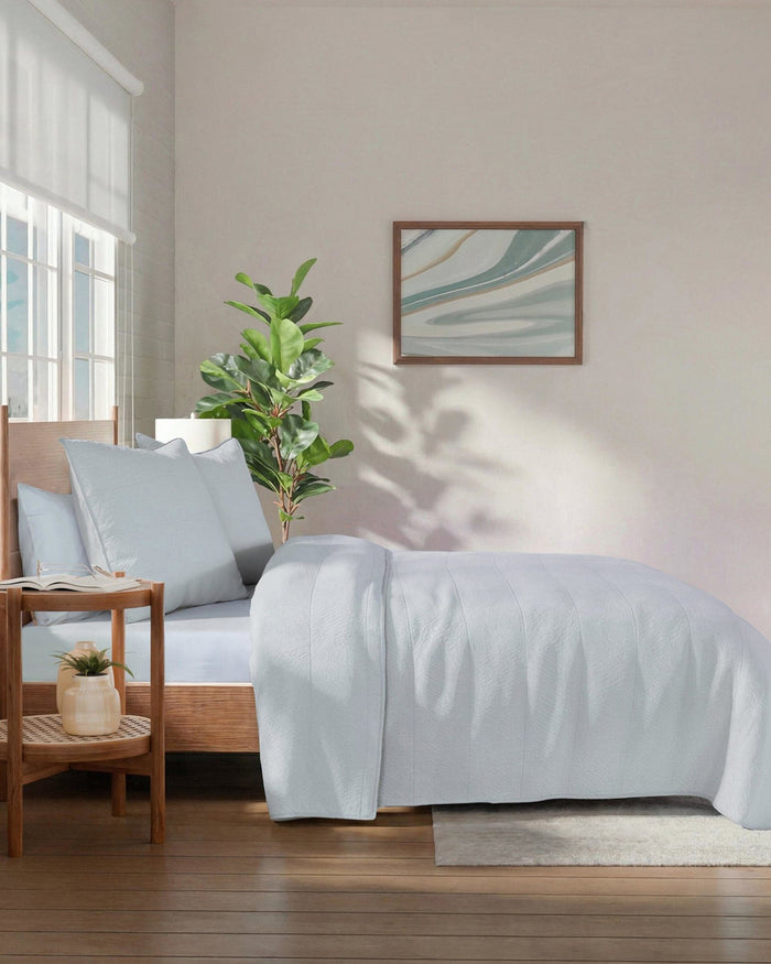 The side view of the Southern Tide Tideline Coverlet Quilt by Southern Tide - Grey