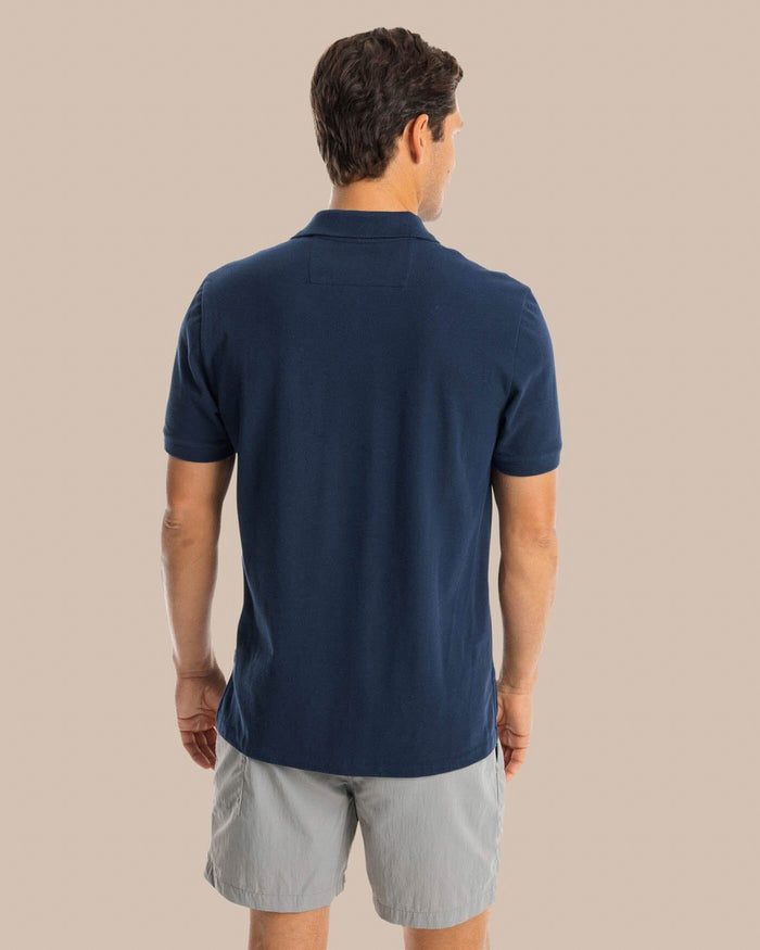 The back view of the Southern Tide USA Flag Skipjack Polo by Southern Tide - Navy