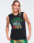 Black sleeveless Zumba graphic tank top with a crew neckline and relaxed fit, featuring colorful “Zumba My Vibe, My Tribe” lettering on the front. Female model wears the top with green, orange, and black abstract print leggings.