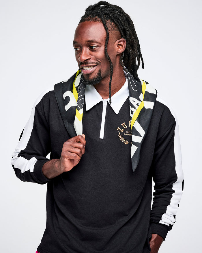 Male model wearing a black and white polo shirt with a bandana.