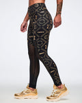 Female model wearing black leggings with gold geometric pattern paired with gold shoes.