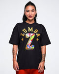 Female model wearing a black t-shirt with colorful 'Zumba' logo on a white background.