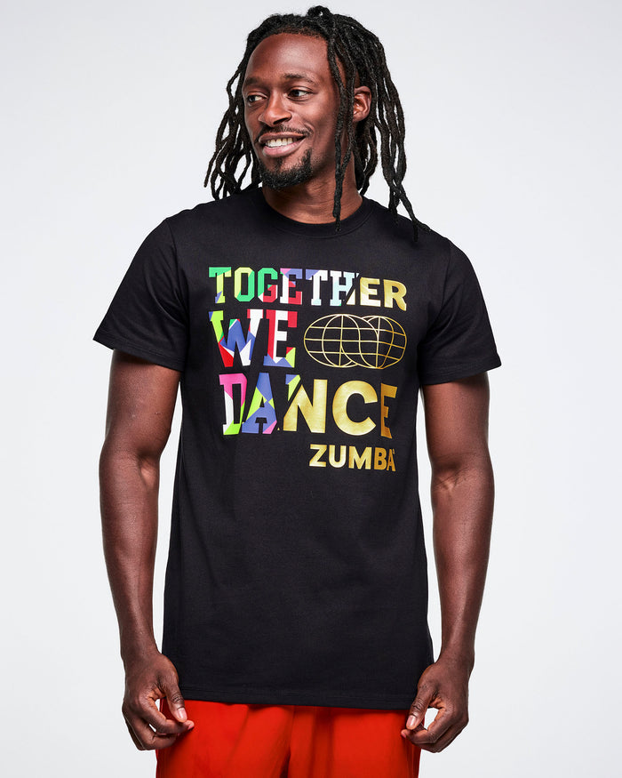 Male model wearing a black Zumba t-shirt with colorful text on a white background.