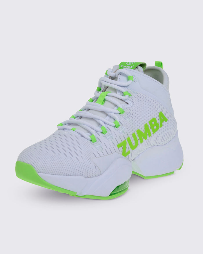 Front view of a white and green Zumba sneaker with “ZUMBA” in green, green-accented laces and sole, and a rear pull loop.