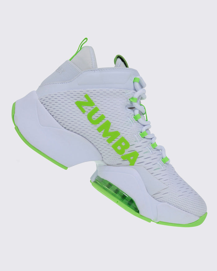 Right-side view of a white and green Zumba sneaker with “ZUMBA” in green, green-accented laces and sole, and a rear pull loop.
