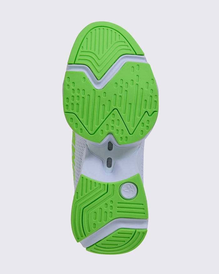 White and green sneaker viewed from the bottom showing a green and white sole with a white Zumbito on the upper heel.
