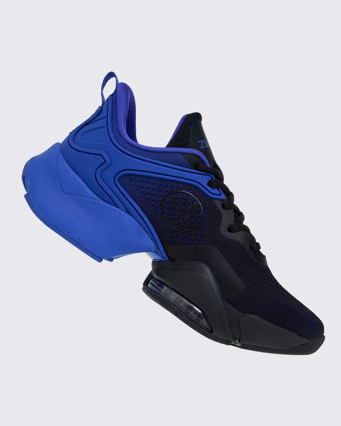 Right side view of blue-and-black Zumba sneaker with the black Zumbito in the center.
