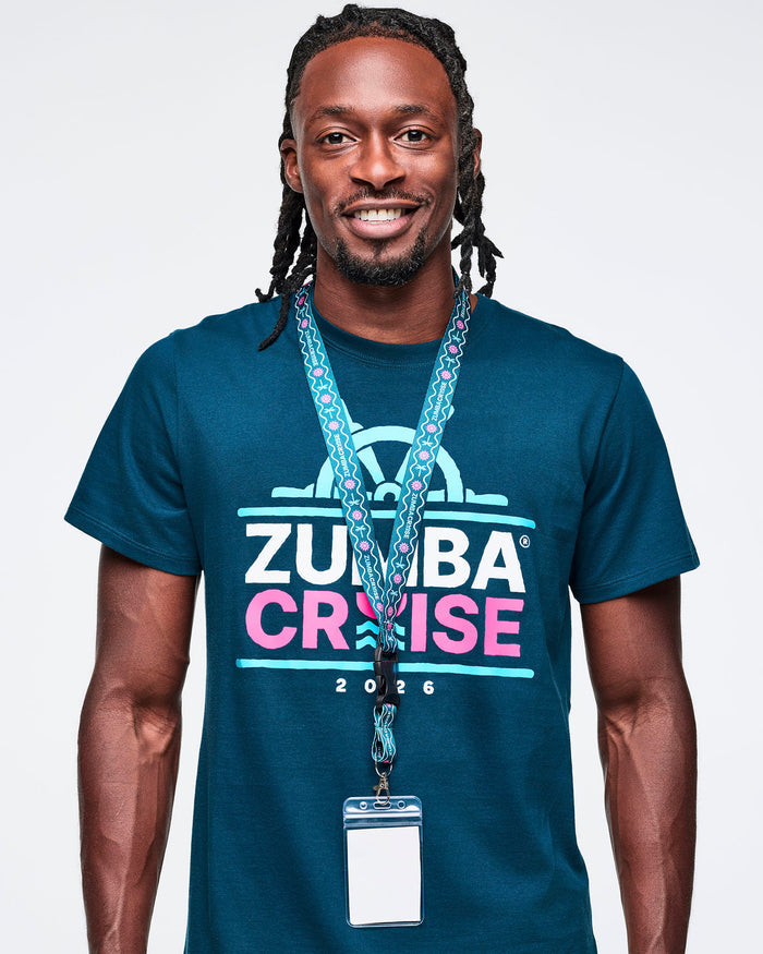 Male model wearing a blue t-shirt with a Zumba Cruise lanyard against a white background.