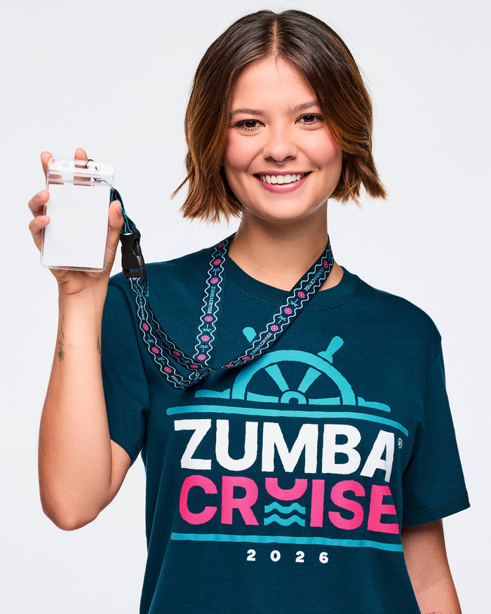 Female model wearing a blue t-shirt holding a lanyard against a plain background.