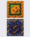 Two Halloween bandanas: orange with a bat print and jack-o'-lantern center, and black with purple ghosts, bats, and spiderwebs and a small orange jack-o'-lantern graphic.