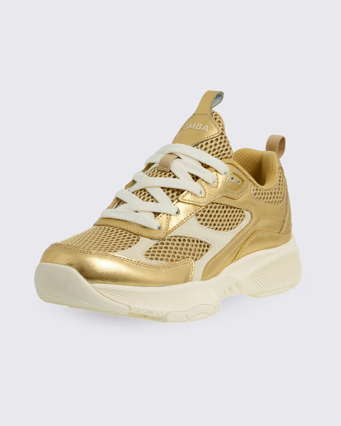 Gold Zumba sneaker on a white background.