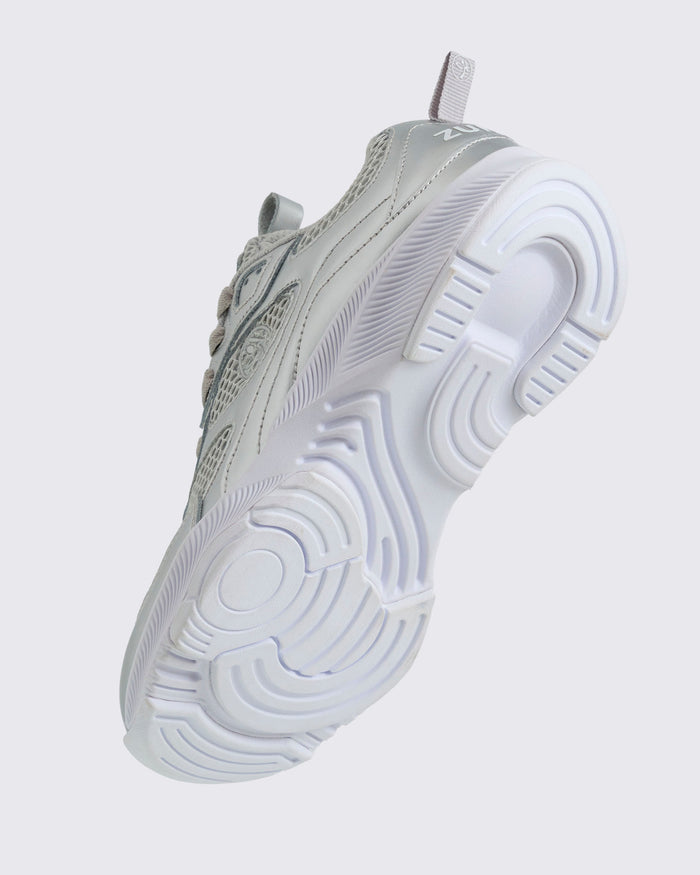 Bottom angle view of the silver sneaker with white sole on a light gray background.