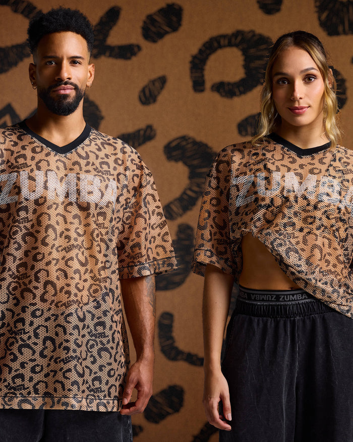 Leopard print mesh tees on male and female models with black pants against a tan leopard print backdrop.